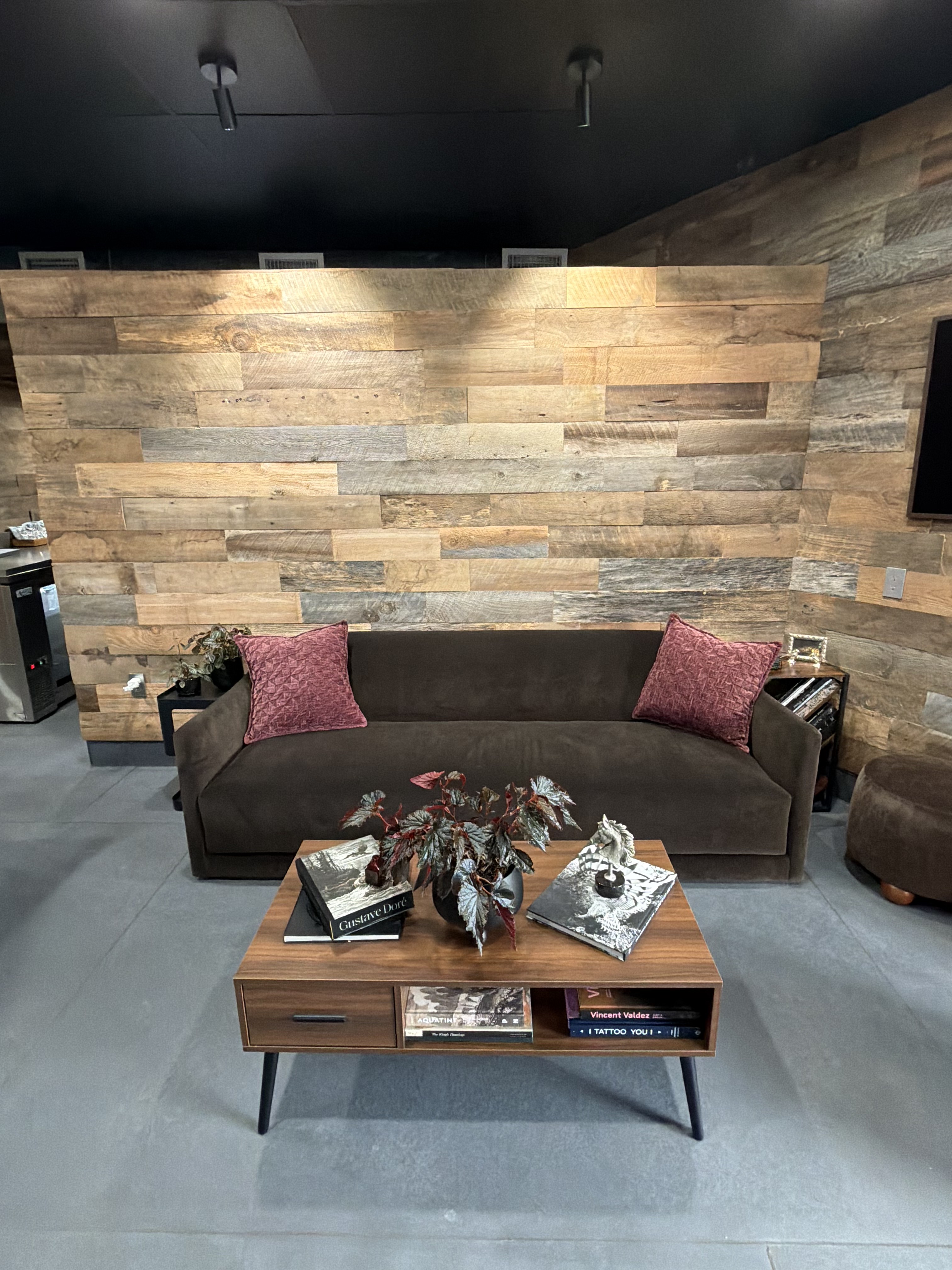 Lounge and seating area with reclaimed wood walls at Double Edge Ink